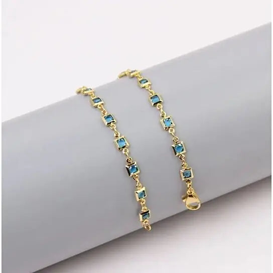 RMZ GOLD NYC 18K Gold Plated Ankle Bracelet Featuring Light Blue Square-Cut Crystal